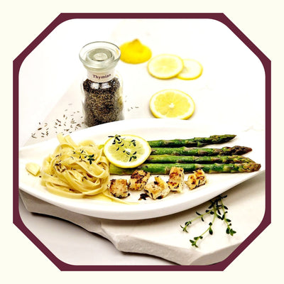 Steinbeißer auf grünem Spargel mit Zitronen-Thymian-Butter